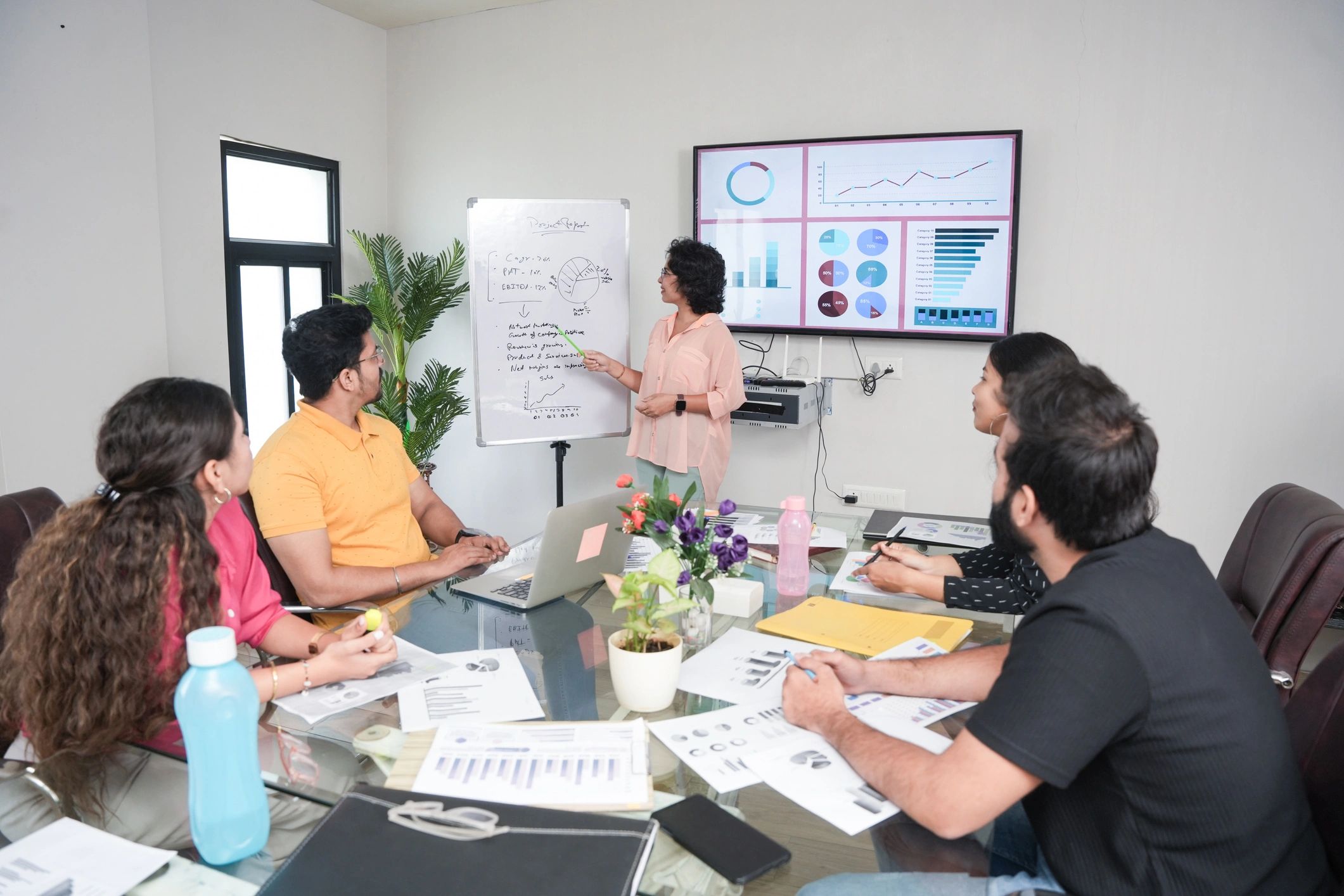 Business leader presenting growth plans to colleagues